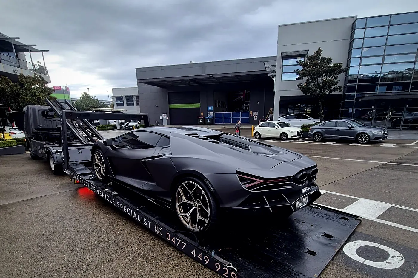 Matte grey Lamborghini secured on HaulKing's branded tray