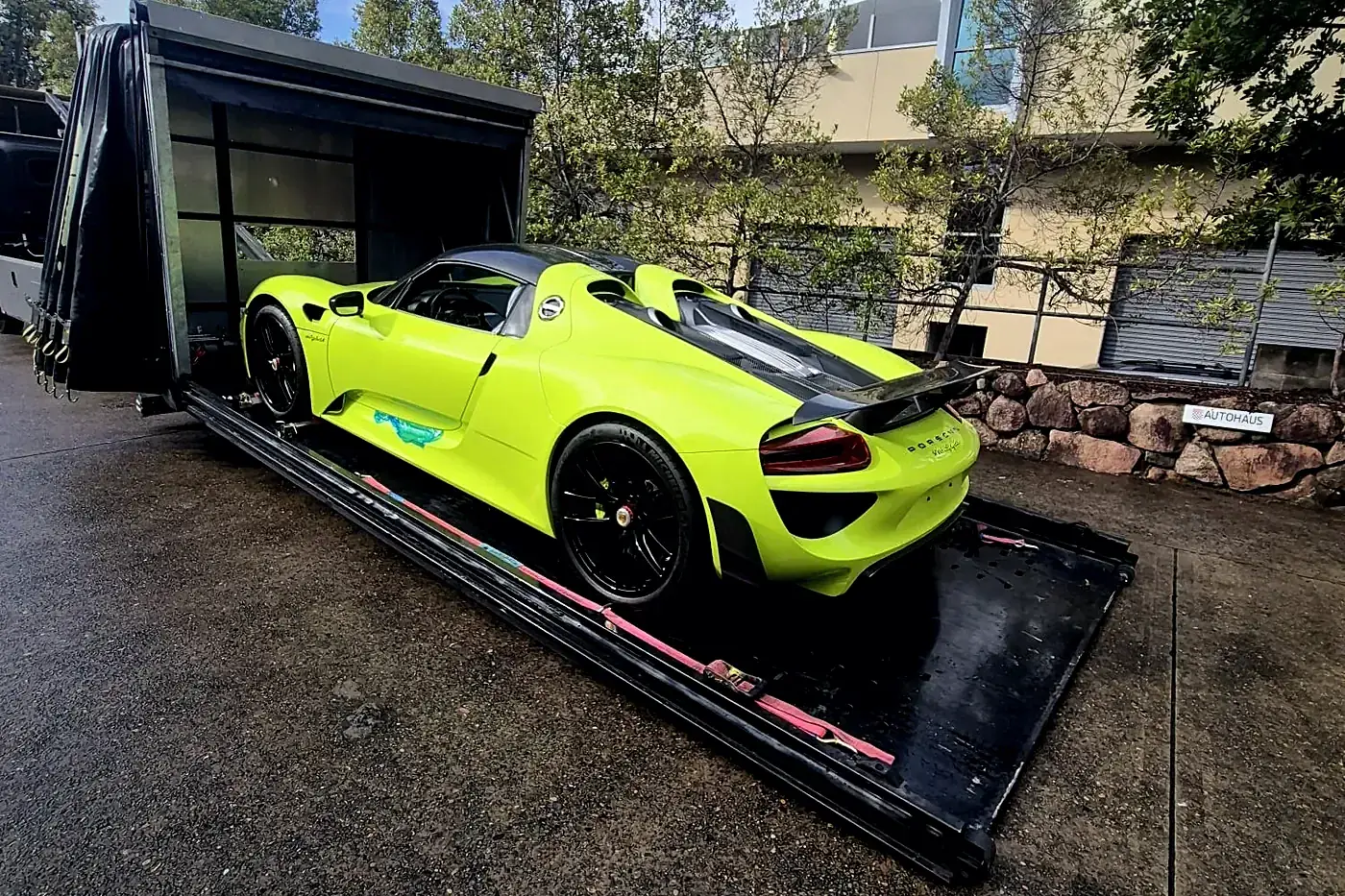 Acid green Porsche 918 Spyder inside HaulKing's enclosed transporter