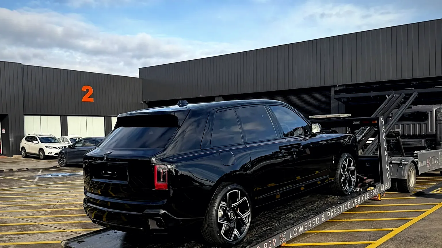 Black Rolls-Royce Cullinan Black Badge loaded on HaulKing's low-angle tilt tray in Sydney