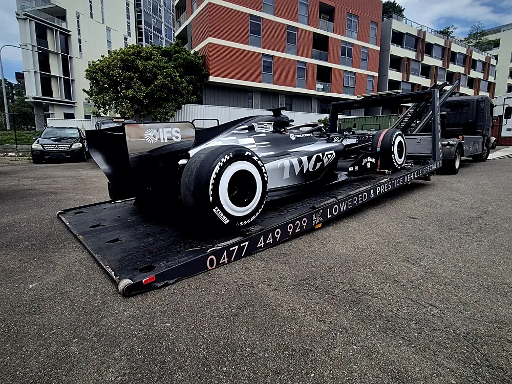 Formula One car strapped to HaulKing's branded tray